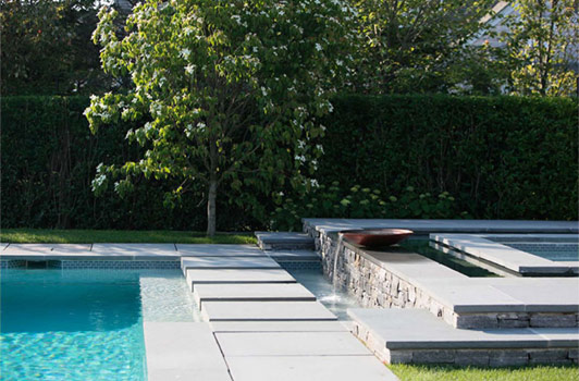 title:To get to the guest house, one must walk across water on a shallow pool shhellf. Large stones were anchored to make the stride comfortable.